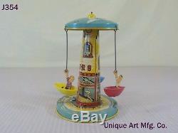 Vintage Antique Unique Art Mfg. Company Tin Wind Up Toy Sail Away Carousel Rare