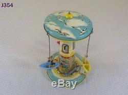 Vintage Antique Unique Art Mfg. Company Tin Wind Up Toy Sail Away Carousel Rare