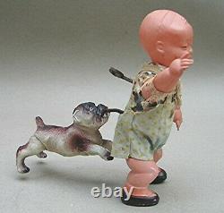 Vintage Celluloid Boy with Bull Dog bitting his behind Wind up Made in Japan