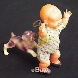 Vintage Celluloid Windup Toy Dog Chasing/Biting Crying Baby Occupied Japan