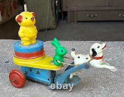 Vintage Dog Carrying Rabbit Bear On Sleigh Tin & Bakelite Plastic Wind Up Toy170