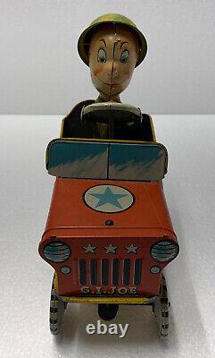 Vintage G. I. Joe and his Jouncing Jeep Wind Up Tin Toy Atomic Brakes 1940's