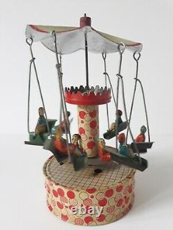 Vintage Gunthermann, Bing, Distler Windup tin carousel swings toy, Germany-SUPERB