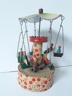 Vintage Gunthermann, Bing, Distler Windup tin carousel swings toy, Germany-SUPERB