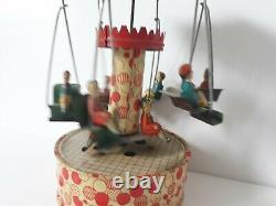 Vintage Gunthermann, Bing, Distler Windup tin carousel swings toy, Germany-SUPERB