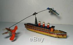 Vintage Kellermann CKO Tin Litho Windup Boat with Circling Airplanes Toy Plane