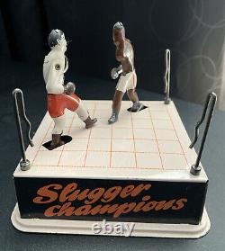 Vintage RARE tin wind up slugger champions