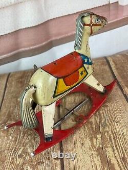 Vintage Rocking Horse Tin Toy Made in Japan Winds up and rocks