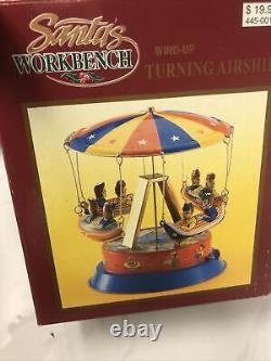 Vintage Santa's Workbench Wind-up Turning Airship Tin Toy Collectible