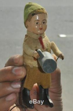 Vintage Schuco Textured Cloth Boy With Jug Litho Wind Up Toy, Germany