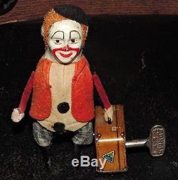 Vintage Schuco Wind-Up Clown With Suitcase Germany with key works