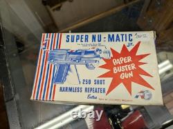 Vintage Super Nu Matic JR. Paper Buster gun in original package! Repeater toy