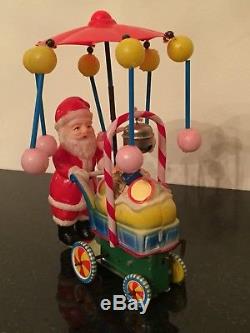Vintage Toy Santa Claus Celluloid Tin Litho Wind Up Spinning Umbrella Baby Buggy
