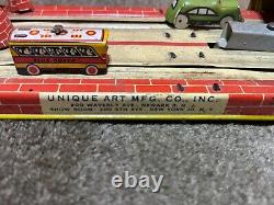 Vintage Unique Art's Mfg Co. Tin Litho Lincoln Tunnel Wind Up Toy, Works Perfect