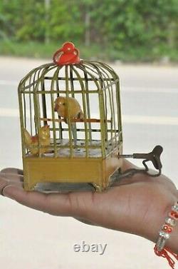 Vintage Wind Up Bird Feeding Baby Litho Tin & Celluloid Toy, Japan/Germany
