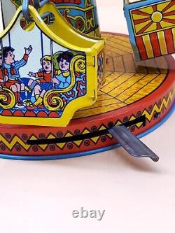 Vintage Wind Up Tin Litho Merry Go Round Toy