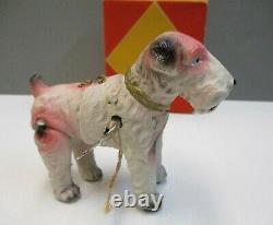 Vintage Wind-up Celluloid AIREDALE TERRIER Dog with Box Fox Terrier