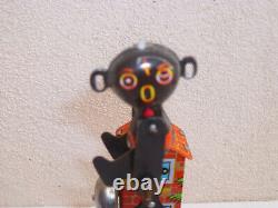 Vintage Yone Japan Carousal Black figure carousal Wind Up Tin Toy