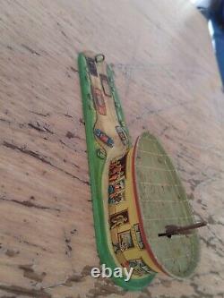 Vintage rustic tin toy hotel with wind up helicopter, made in western germany