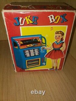 Vintage tin toy wind up Juke Box Haji Japan in original box working great clean