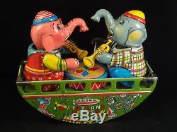 Vintage tin toy wind up musician trumpet player elephant drums JAPAN Toyland 60s
