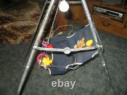 Vintage windup manual hand crank baby seat swing. Removable toys. Works